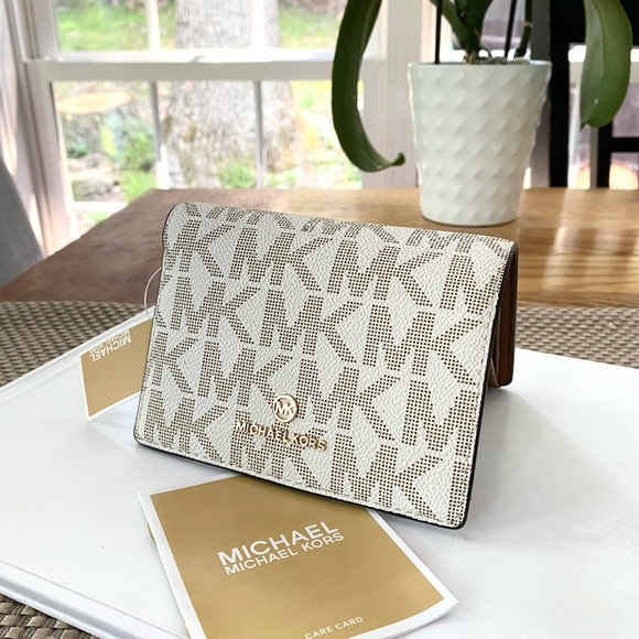 Michael Kors Handbags - NWT authentic MK monogram billfold wallet vanilla